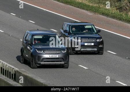 Two Range Rover luxury prestige models; SUV vehicle traveling on the M6 motorway near Preston in Lancashire, UK Stock Photo