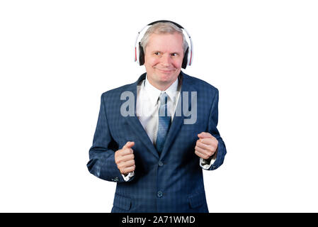 An elderly man in a suit, and headphones. Isolated on a white background. Stock Photo