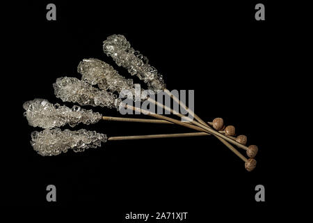 Brown cane sugar, cube sugar and crystalic sugar on wooden sticks isolated on white background. Top view. Stock Photo