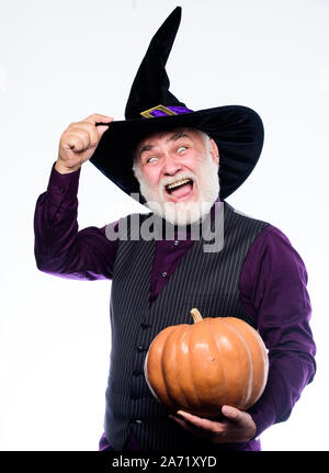 Experienced and wise. Magic spell. Halloween tradition. Cosplay outfit. Senior man white beard celebrate Halloween. Wizard costume hat Halloween party. Magician witcher old man. Magic concept. Stock Photo
