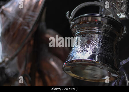 Metal cauldron close-up. Patterns on the flower. Stock Photo