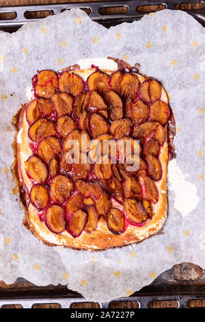 bavarian plum pie on dark wood Stock Photo