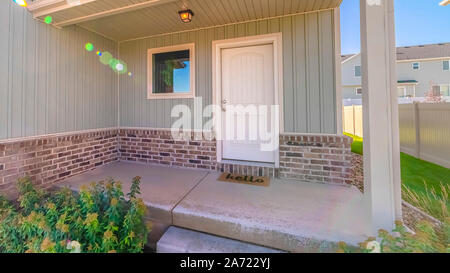 Panorama frame Front door and porch of modern two storey home Stock Photo