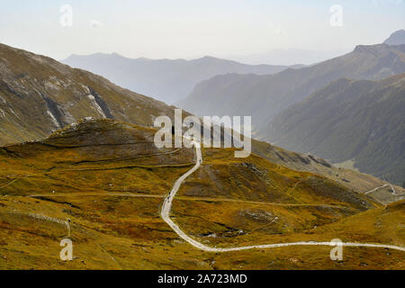 Elevated view of Colle dell'Agnello mountain pass in the Italian Alps with the serpentine road which leads to Mario Bottero Refuge, Piedmont, Italy Stock Photo