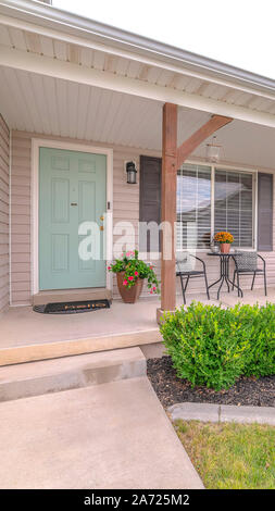 An exterior wall of a house with landscaped tall bushes Stock Photo - Alamy