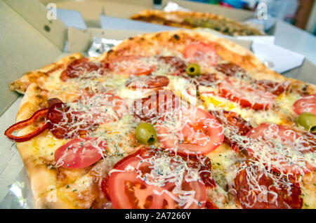 Two pizzas delivered for employees working late in the office Stock Photo