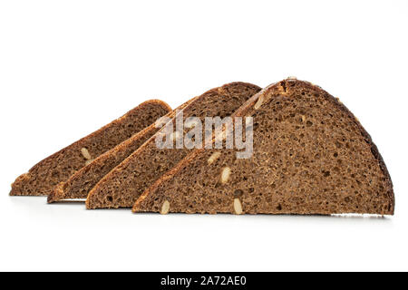 Group of four slices of fresh baked dark bread in row isolated on white background Stock Photo