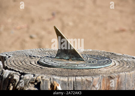 Sun Dial on a Stump Stock Photo