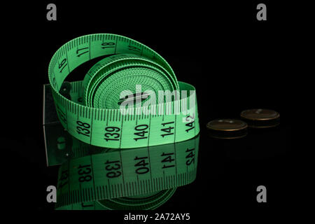 One whole haberdashery item tape isolated on black glass Stock Photo
