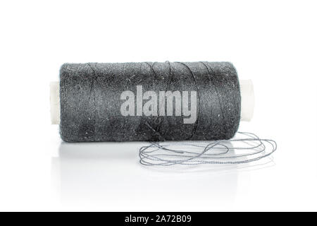 One whole haberdashery item grey spool with thread isolated on white background Stock Photo