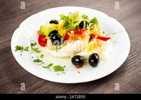 Homemade pickled gentian, moldy cheese in oil with vegetable Stock Photo