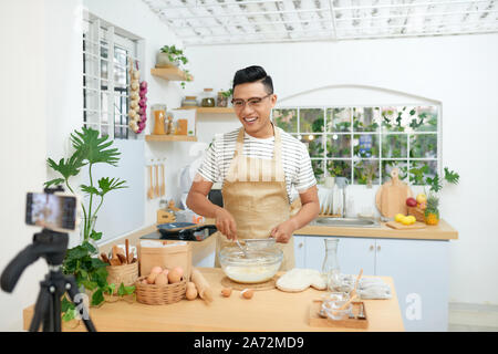 Food blogger recording video in his workplace Stock Photo