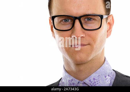 A handsome hipster young man with formal suit sitting on a stool