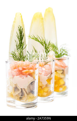 Fish buffet: shrimp cocktails in a row isolated on white background Stock Photo