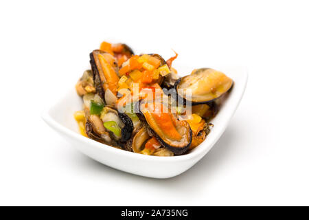 Mussel salad in a white bowl Stock Photo