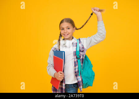 Long And Braided Cute Small Schoolchild Hold Long Hair Braid On