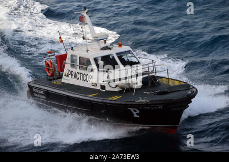 Harbour Pilot Boat coming alongside a Cruise Ship in the Bay at Palma, Mallorca, Balearic Islands, Spain, EU. Stock Photo