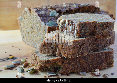 Chrono, organic, unleavened bread with various seeds, pumpkin, sunflower, flax seeds, delicious and very healthy, side view, close up Stock Photo