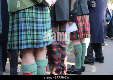 Scottish men in tartan kilts and trews Stock Photo