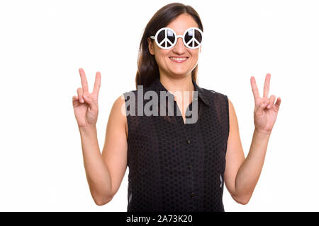 Portrait of beautiful woman wearing sunglasses with peace sign and posing Stock Photo