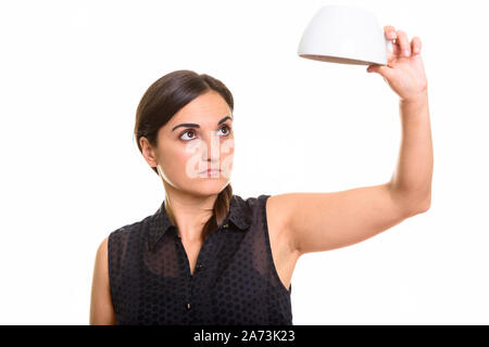 Beautiful woman holding empty coffee cup upside down Stock Photo