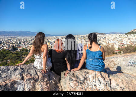 women enjoying the fantastic view from the outlook mountain Areopagus overseeing Athens city Stock Photo