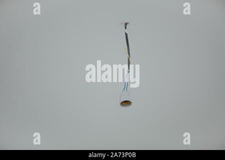 bulb holder. lamp holder hanging on the ceiling Stock Photo