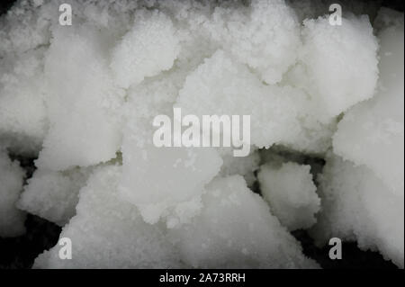 White pieces of wax parts with small granules. Blocks of organic wax Stock Photo