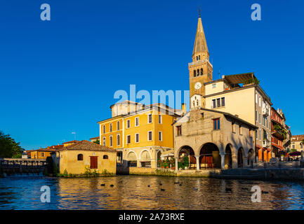 Cityscape of old historical buildings and Lemene river in Portogruaro, Venezia, Veneto, Italy Stock Photo