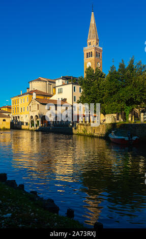 Cityscape of old historical buildings and Lemene river in Portogruaro, Venezia, Veneto, Italy Stock Photo