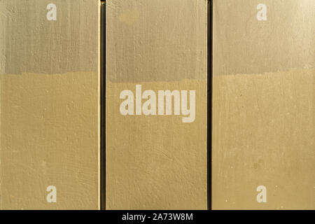 Metallic vertical blocks painted with beige colored and obtained concrete appearance. Stock Photo