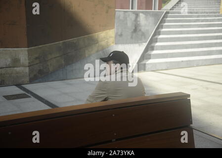 Man sitting on a bench in northern Spain, pasakdek Stock Photo