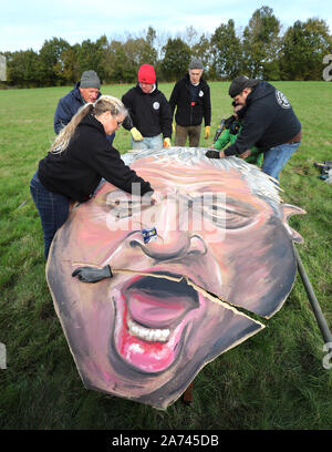 The effigy of Speaker John Bercow, made by the Edenbridge Bonfire Society, is repaired after it ripped after being put up at Breezehurst Farm Industrial Park, it will be burned at an annual bonfire celebration in Edenbridge, Kent. Stock Photo
