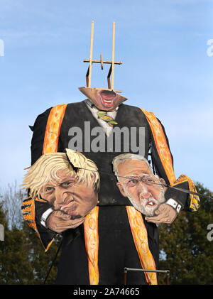 An effigy of Speaker John Bercow, whose head is being repaired, holding the heads of Prime Minister Boris Johnson and Labour party leader Jeremy Corbyn, by the Edenbridge Bonfire Society at Breezehurst Farm Industrial Park, which will be burned at an annual bonfire celebration in Edenbridge, Kent. Stock Photo