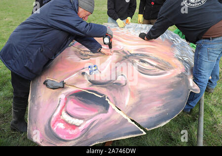 The effigy of Speaker John Bercow, made by the Edenbridge Bonfire Society, is repaired after it ripped after being put up at Breezehurst Farm Industrial Park, it will be burned at an annual bonfire celebration in Edenbridge, Kent. Stock Photo