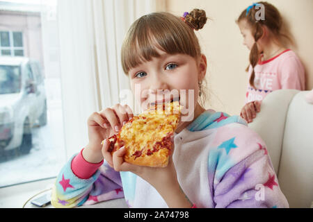 Large family, children have fun and play in the morning at home. Boys and girls in night pajamas, a friendly big family. Russia, Sverdlovsk, 10 March Stock Photo