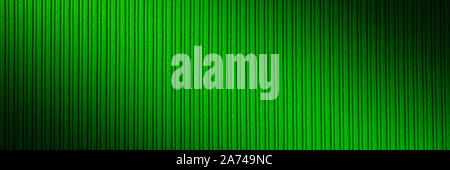 Decorative background green color, striped texture, diagonal gradient. Wallpaper. Art Design Stock Photo