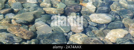 Background of sea colored stones under water Stock Photo