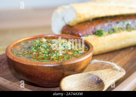 Food photography of the Argentinian hot dog choripan with chimichurri salsa Stock Photo