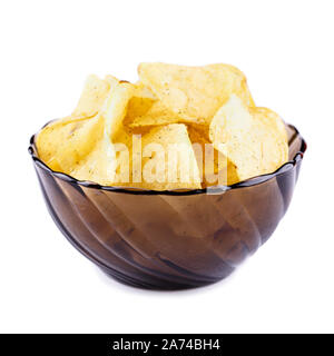 Potato chips falling in the plate. Isolated on white background Stock Photo