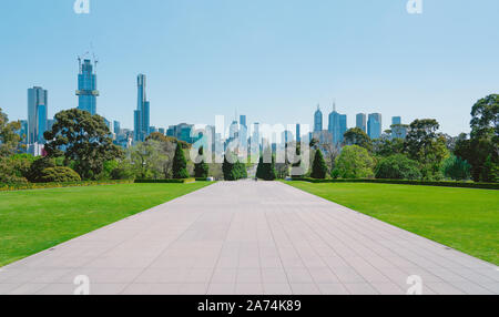 Melbourne cityscape view with empty cement floor and green grass . Stock Photo