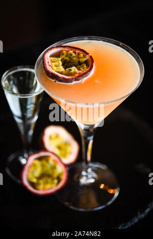 Tasty passion fruit & prosseco cocktail with fresh fruit, prosseco and ice flakes Stock Photo