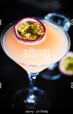 Tasty passion fruit & prosseco cocktail with fresh fruit, prosseco and ice flakes Stock Photo