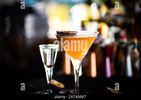 Tasty passion fruit & prosseco cocktail with fresh fruit, prosseco and ice flakes Stock Photo