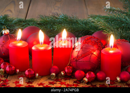 Advent wreath with burning candles and wooden background Stock Photo