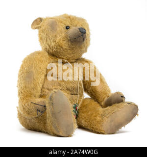 Vintage teddy bear on plain white background Stock Photo