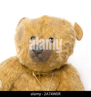 Vintage teddy bear on plain white background Stock Photo