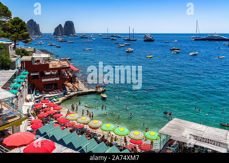 View of Marina Piccola, a pretty beach beach with a view of the Faraglioni. Capri, Campania, Italy,  June 2019 Stock Photo