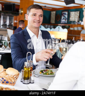 Portrait of beautiful couple having romantic dinner in restaurant Stock Photo