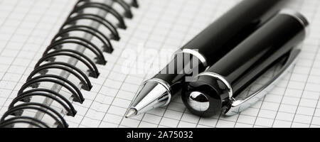 Notebook with ballpoint pen close-up background Stock Photo